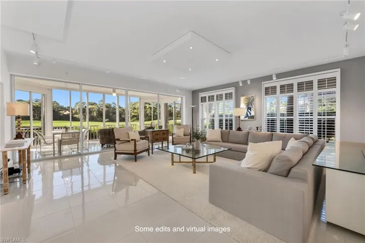Virtually staged accessories. This condo lives like a villa! Wide Great Room, beautiful lit rooms.