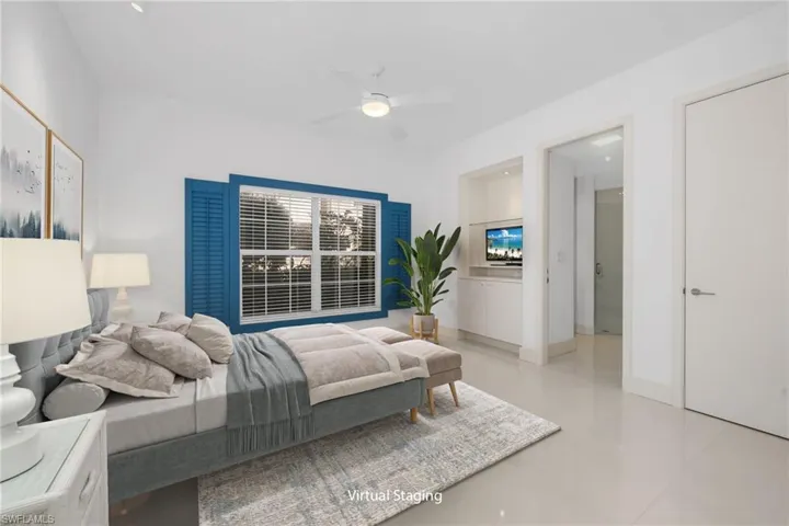 Virtually staged, bed, rug, and plant. Another En-Suite bedroom - built-in and closet for extra storage.