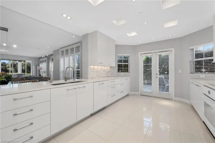 Open to Dining and Great Room. French Doors lead to outdoor patio.
