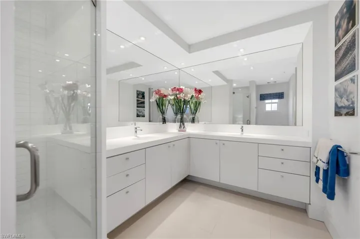 This bathroom could serve as a second owner suite.  Dual sinks, and plenty of cabinetry!