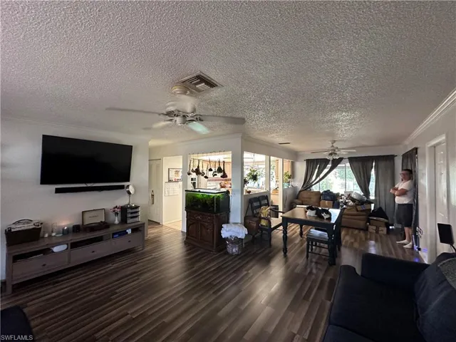 Living Area View to Dining Area and Kitchen.