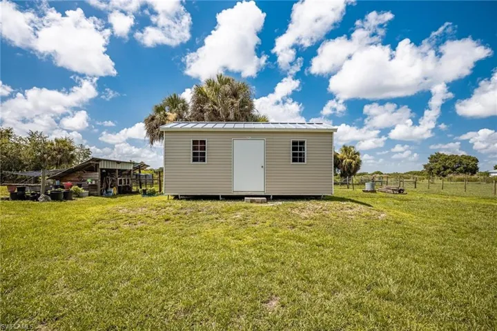 A yard and a storage shed