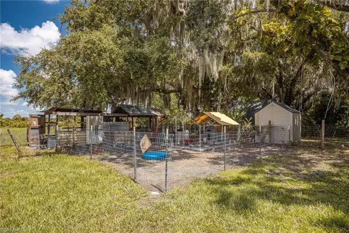 View of yard with an outdoor structure