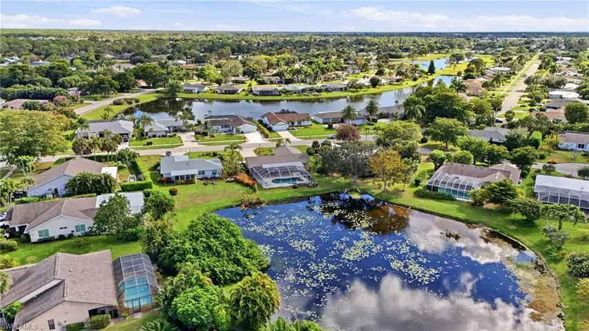 AERIAL VIEWS OF COMMUNITY WITH CHARMING WINDING STREETS AND PONDS THROUGHOUT...
