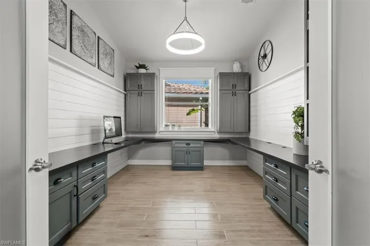 Unfurnished office featuring light wood-type flooring