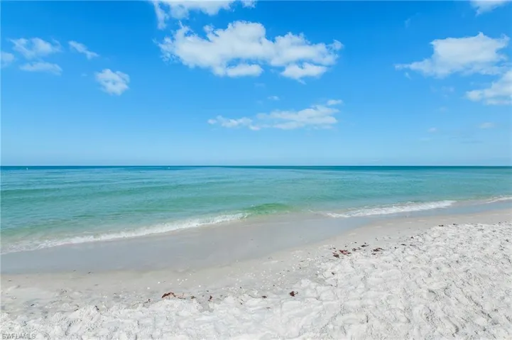 Property view of water with a beach view