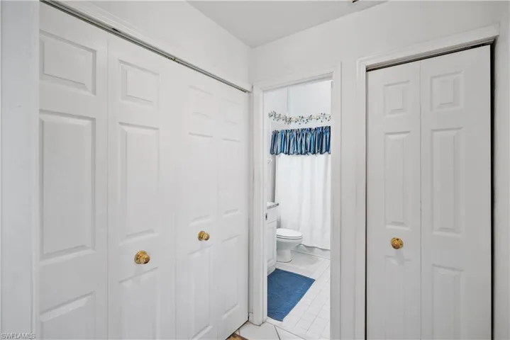 Hall featuring tile patterned floors