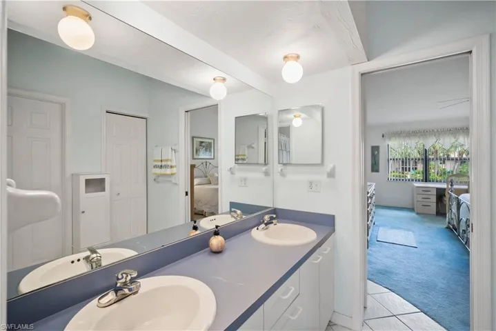 Bathroom featuring vanity and tile patterned flooring