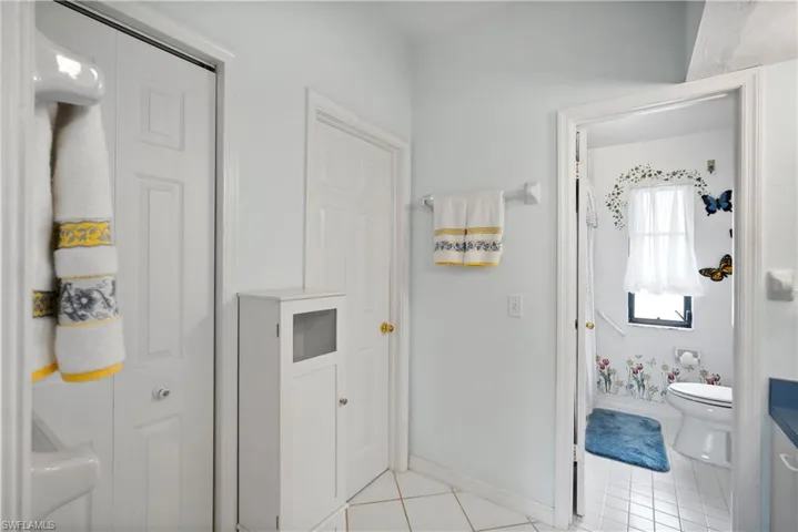 Bathroom featuring tile patterned floors and toilet