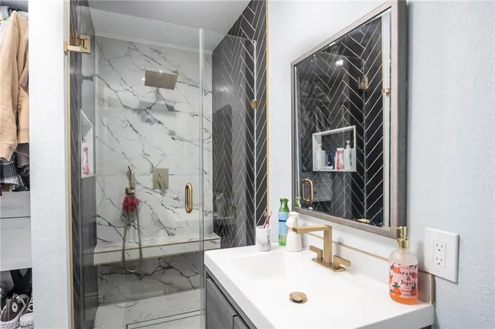 Bathroom with vanity and an enclosed shower