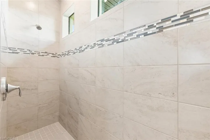 Large shower with high windows