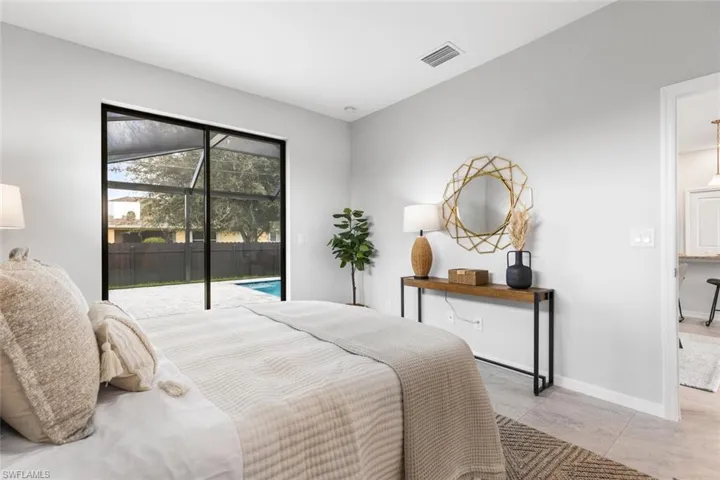 Tiled bedroom with access to outside