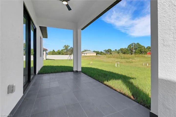 View of patio featuring ceiling fan