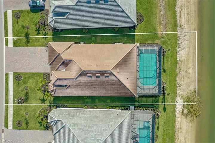 Aerial view of property and surrounding area featuring property boundaries highlighted