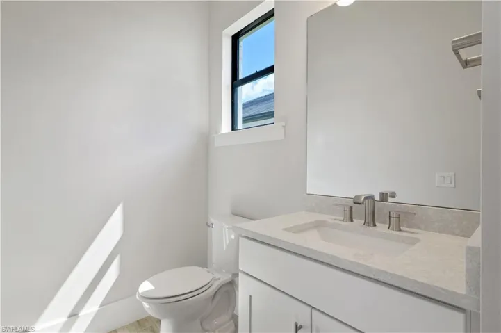 Half bath with toilet and vanity