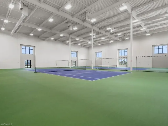 View of tennis court with community basketball court