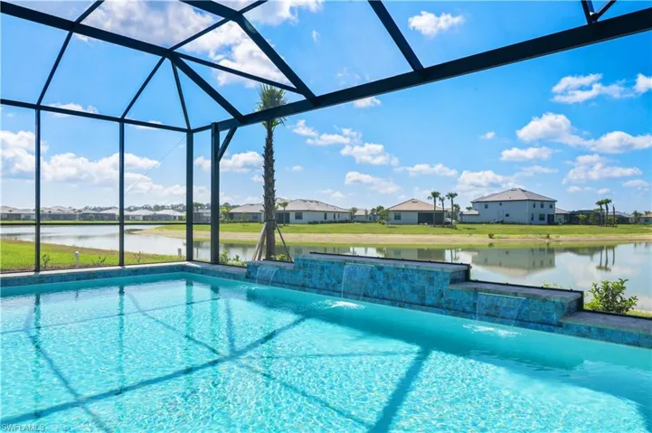 Outdoor pool featuring a water view, a lanai, and a residential view