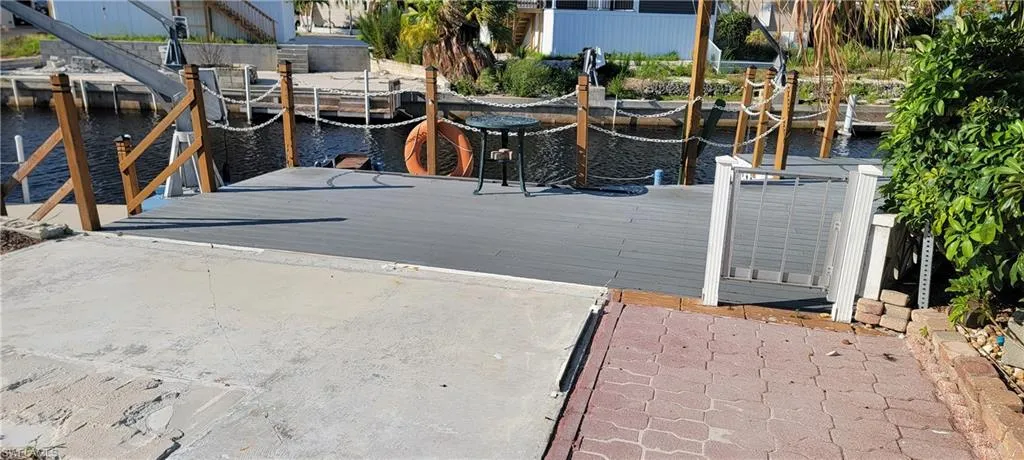 Dock area featuring a water view