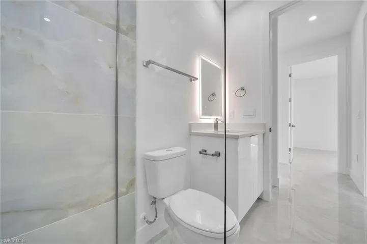 Bathroom featuring vanity and recessed lighting