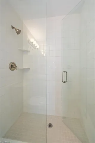 Full bathroom with a shower stall