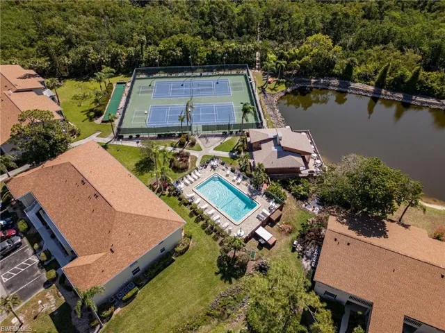 Drone / aerial view of a pool and a large body of water