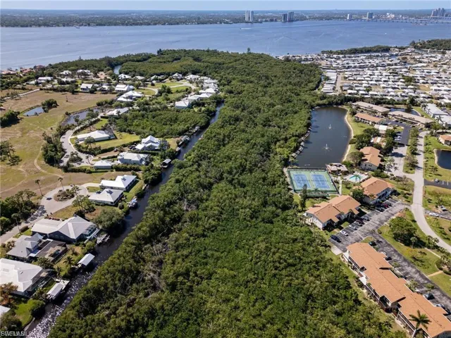 View of property location with nearby suburban area and a large body of water