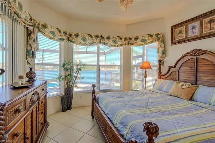 Bedroom featuring baseboards and light tile patterned floors