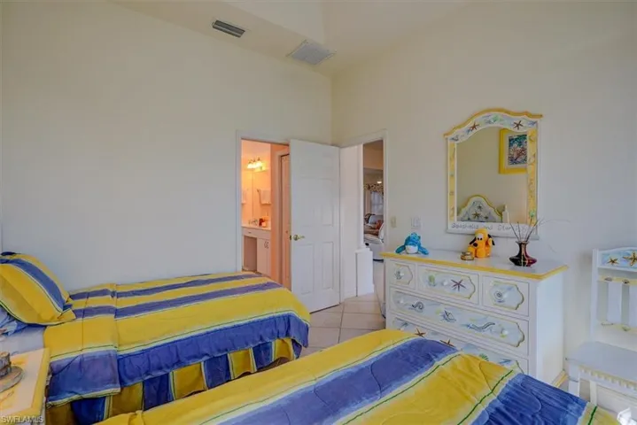 Tiled bedroom with visible vents
