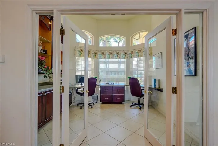 Home office with light tile patterned floors