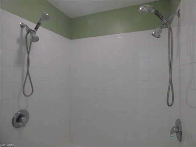 View of large shower with 2 shower heads!