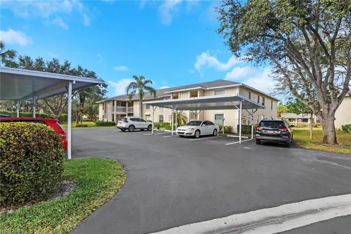 Partially covered parking lot with a residential view