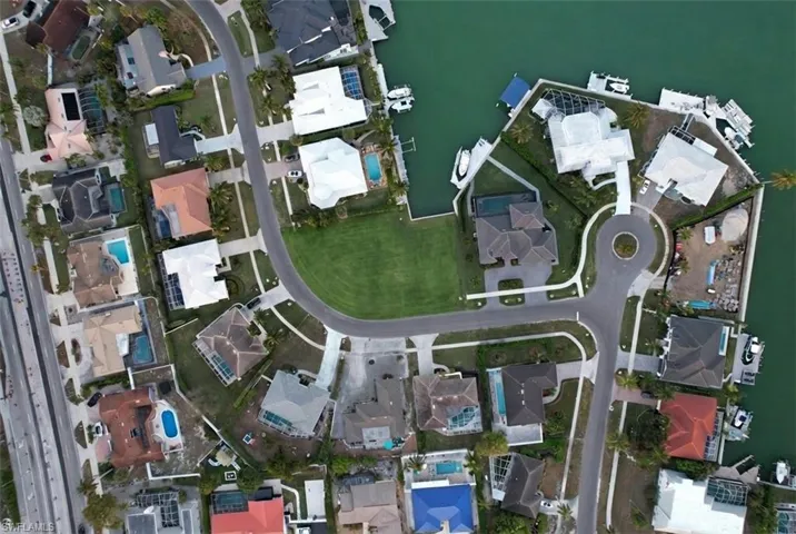 View of property location with nearby suburban area