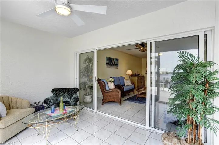 Outdoor balcony leads to the indoor Sun Room and onto the Great Room.