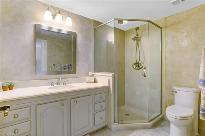 Guest bedroom with quartz counters, new shower, lighting, plumbing.