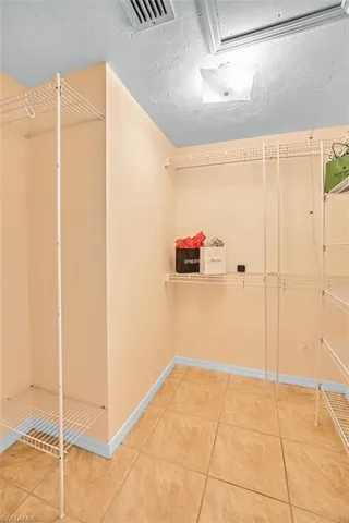 Walk in closet featuring light tile patterned floors