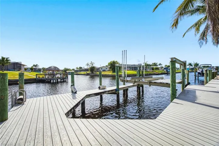 Dock with boat lift and a water view