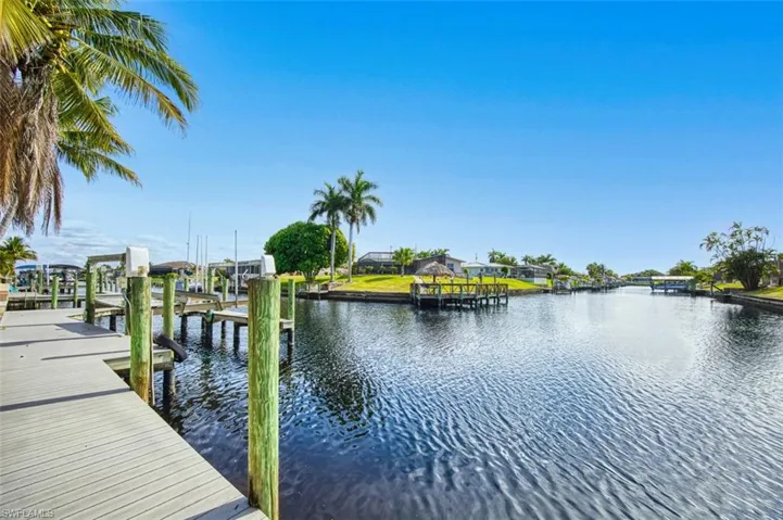 Dock with boat lift and a water view