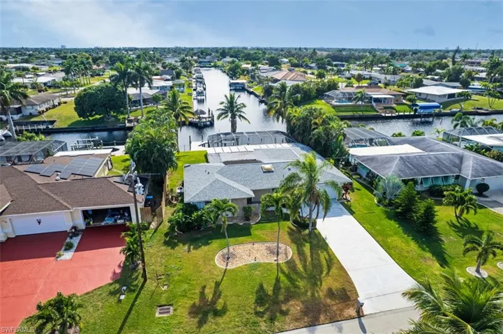 Aerial view of residential area featuring a large body of water