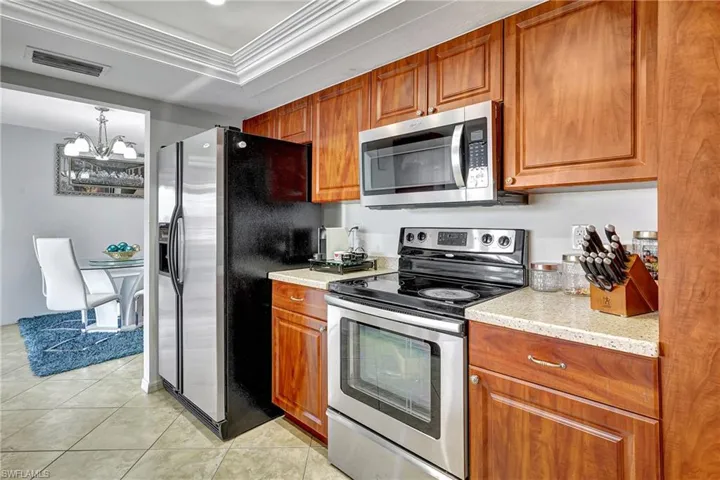 Large kitchen with stainless steel appliances.