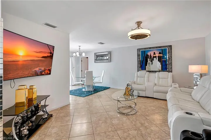 Walk in to a lovely, open living room that opens to a waterfront lake view