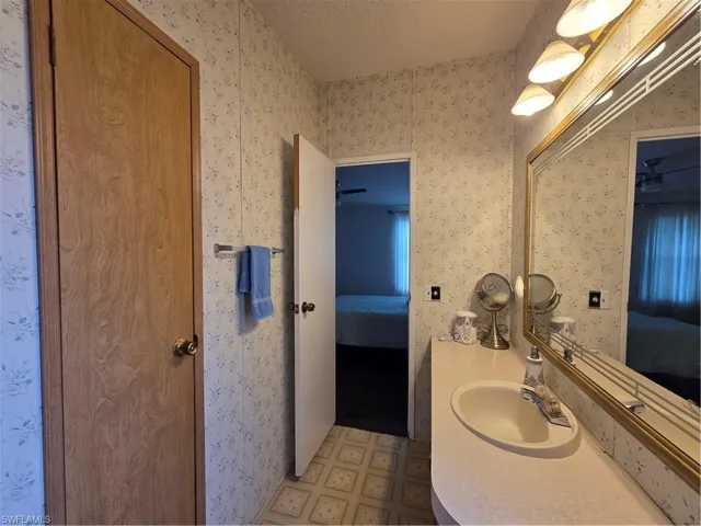 Primary Bathroom with linen closet for extra storage.