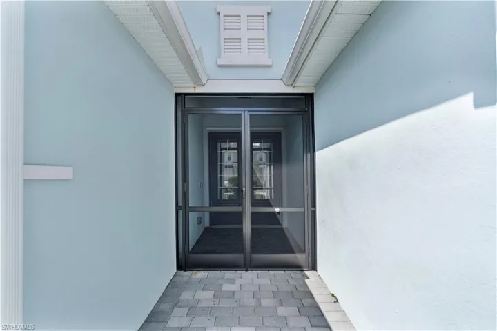 Property entrance with french doors