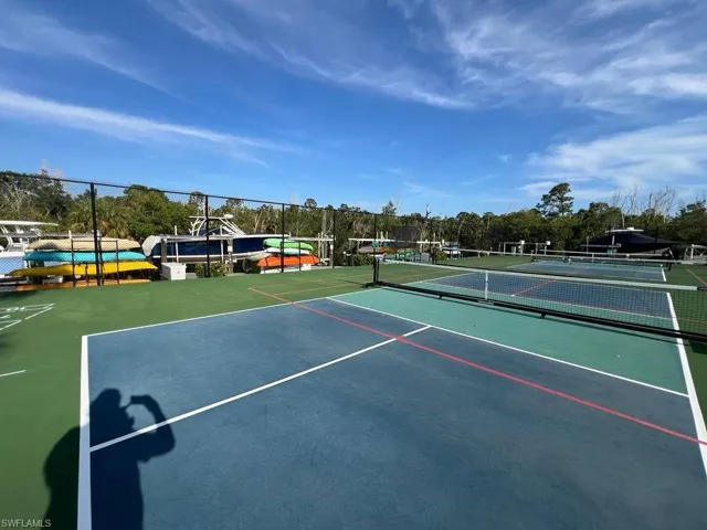 Multiple outdoor pickleball courts with durable surfacing and permanent nets