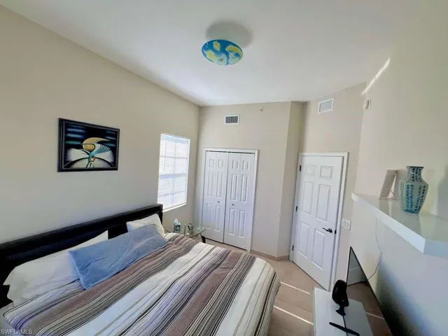 Interior room featuring light-toned walls and tile flooring