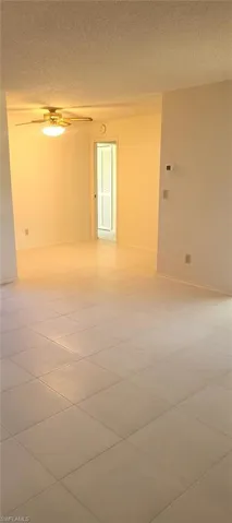 Unfurnished room featuring tile patterned floors