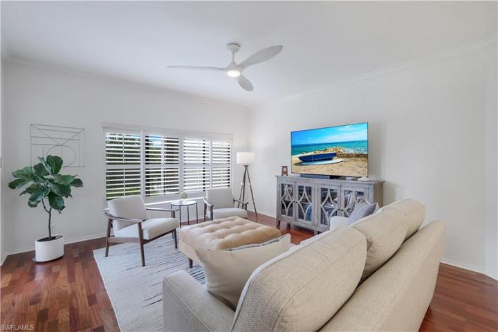 Living area is open to the dining room and kitchen.