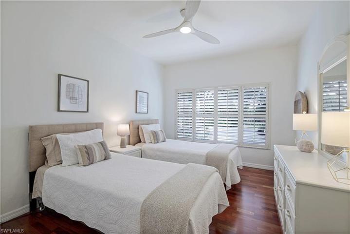 Spacious guest bedroom. Yes, hardwood flooring in this area too!
