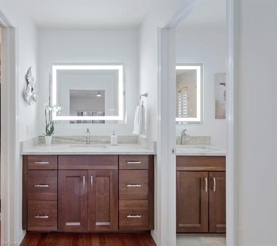 Fully renovated primary bathroom with LED mirrors.