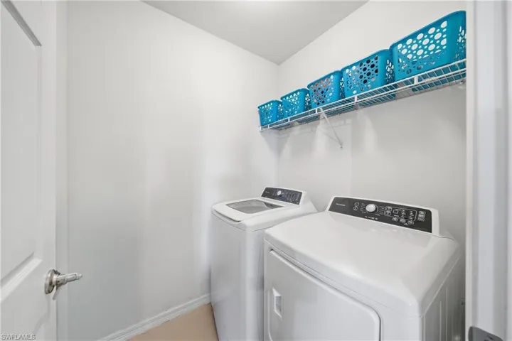 Laundry room with washing machine and dryer