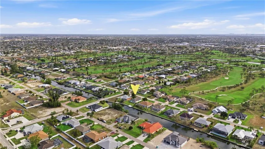 Aerial view of residential area with a nearby body of water